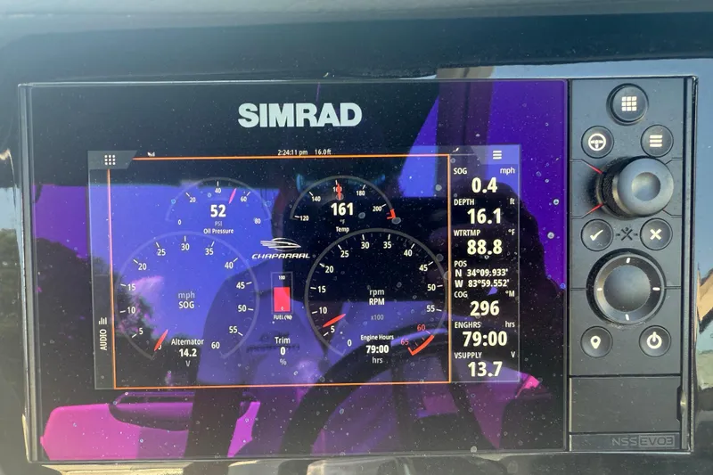 Slide: The Image of Simrad display on 2024 Chaparral 26 Surf showing engine metrics and navigation data. - 10