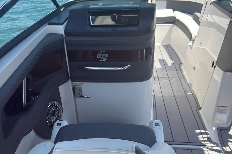 Slide: The Image of 2024 Chaparral 26 Surf boat interior with sleek seating and modern design. - 11