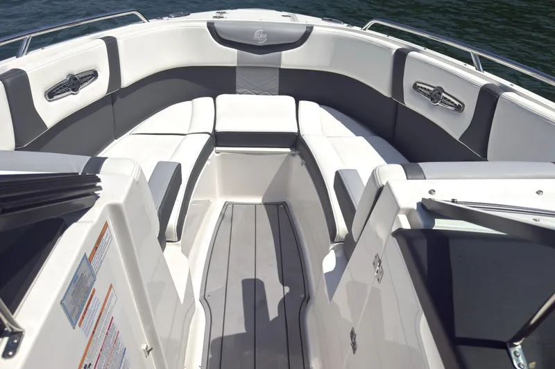 Slide: The Image of 2024 Chaparral 26 Surf boat interior with luxurious seating and sleek design. - 12