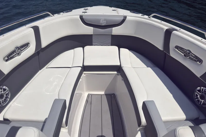 Slide: The Image of 2024 Chaparral 26 Surf boat interior with luxurious seating and sleek design. - 13