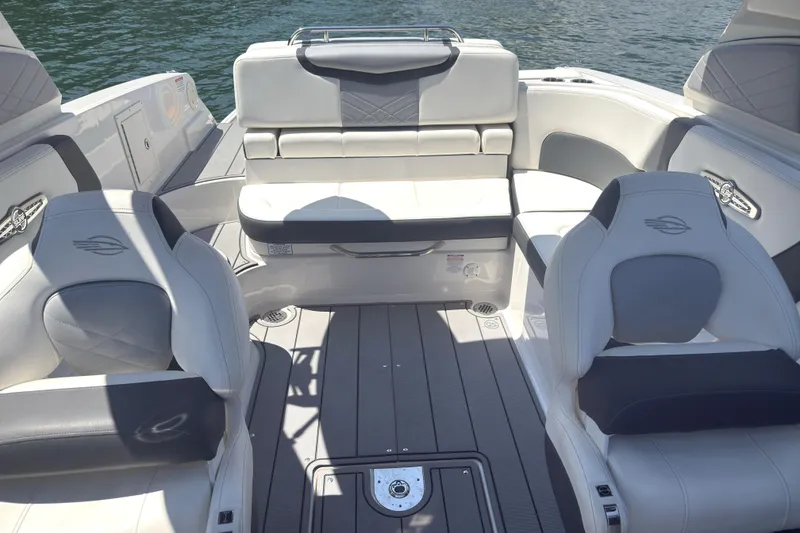 Slide: The Image of 2024 Chaparral 26 Surf boat interior with luxurious seating and modern design. - 17