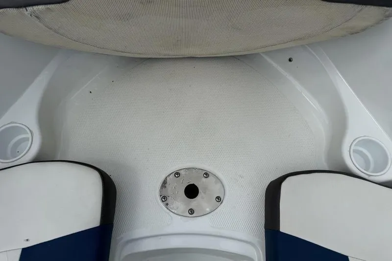 Slide: The Image of Interior view of a 2019 Tahoe 450 TS boat, featuring seating and cup holders. - 11