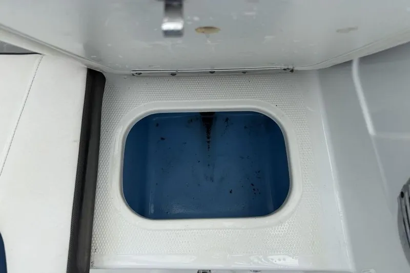 Slide: The Image of Open storage compartment in 2019 Tahoe 450 TS boat. - 15