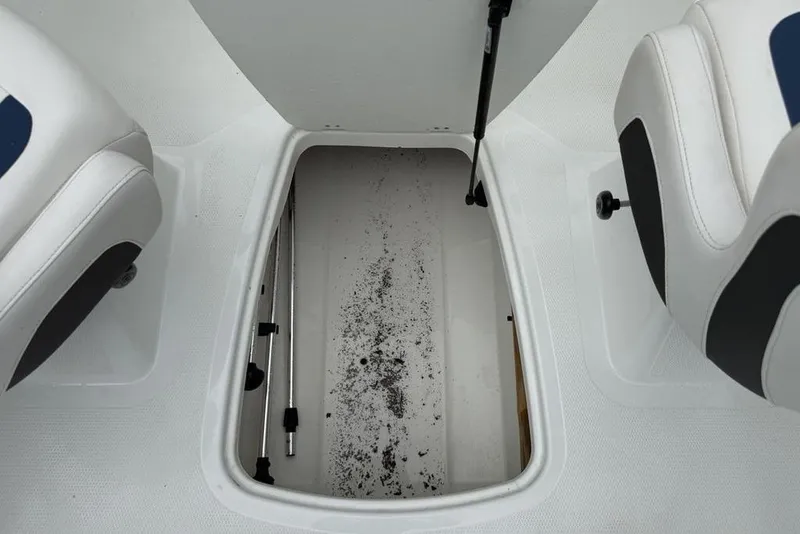 Slide: The Image of Open storage compartment in 2019 Tahoe 450 TS boat, showing interior details. - 19