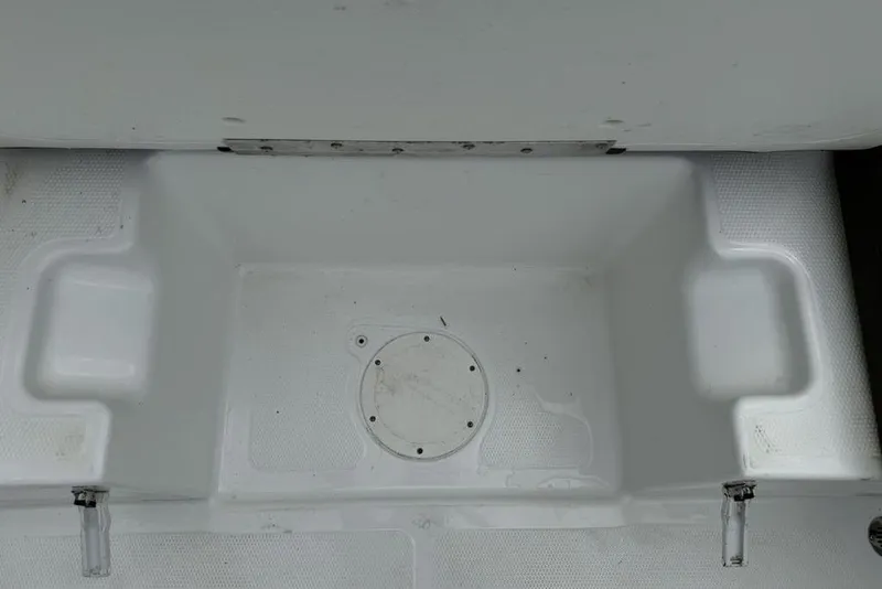 Slide: The Image of 2019 Tahoe 450 TS boat interior, white compartment with circular hatch. - 20