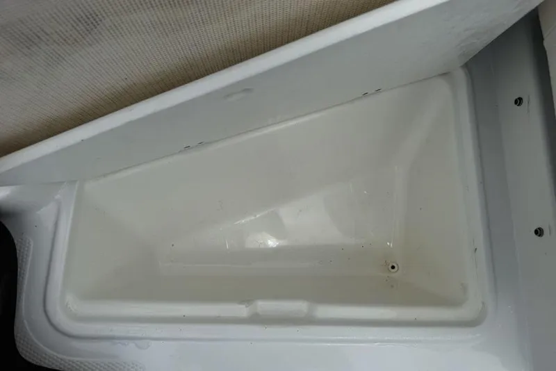 Slide: The Image of Open storage compartment in a 2019 Tahoe 450 TS boat. - 6