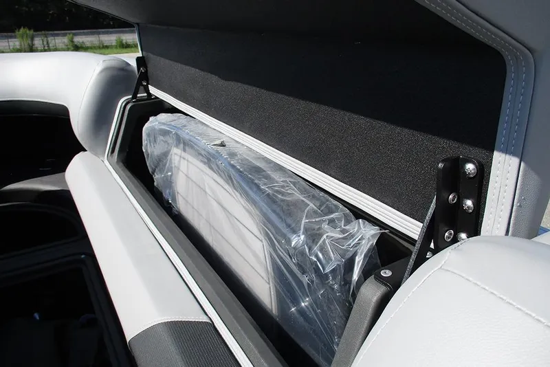 Slide: The Image of Storage compartment in 2026 Sun Tracker SportFish 20 DLX boat, featuring sleek design and secure closure. - 14