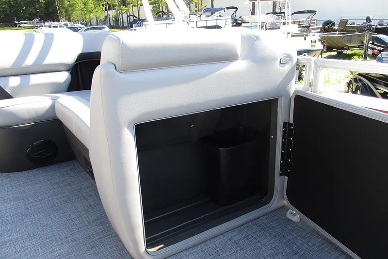 Slide: The Image of 2026 Sun Tracker SportFish 20 DLX boat interior storage compartment with open door. - 16