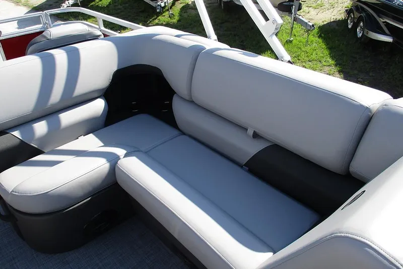Slide: The Image of 2026 Sun Tracker SportFish 20 DLX boat interior with comfortable gray seating. - 17