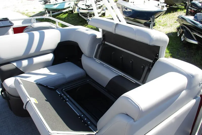 Slide: The Image of 2026 Sun Tracker SportFish 20 DLX boat interior with open storage compartment. - 18