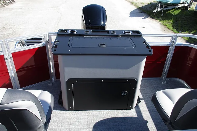 Slide: The Image of 2026 Sun Tracker SportFish 20 DLX boat interior with seating and control panel. - 23