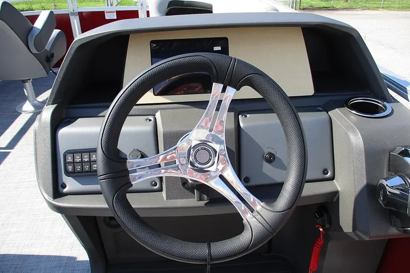Slide: The Image of Steering console of 2026 Sun Tracker SportFish 20 DLX pontoon boat, featuring modern controls. - 28