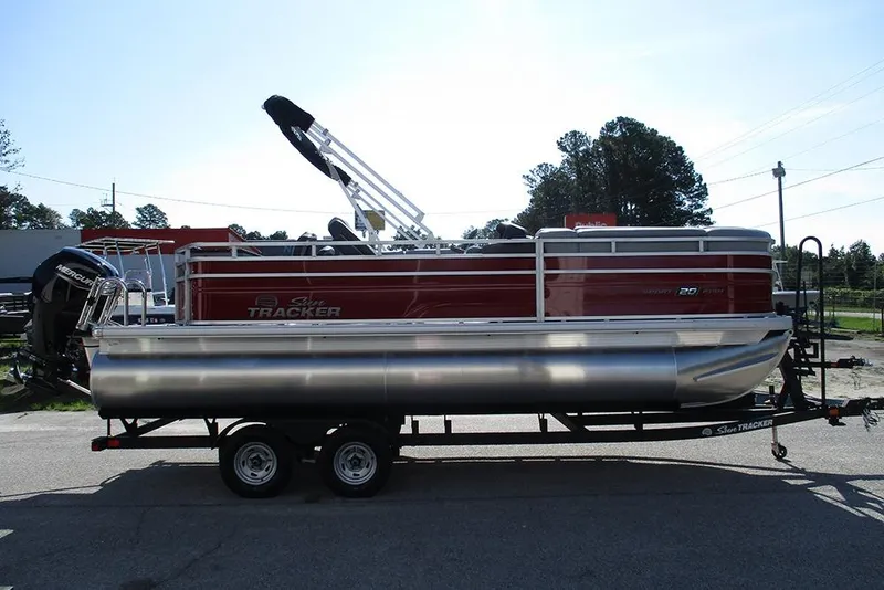 Slide: The Image of 2026 Sun Tracker SportFish 20 DLX pontoon boat on trailer, side view. - 6
