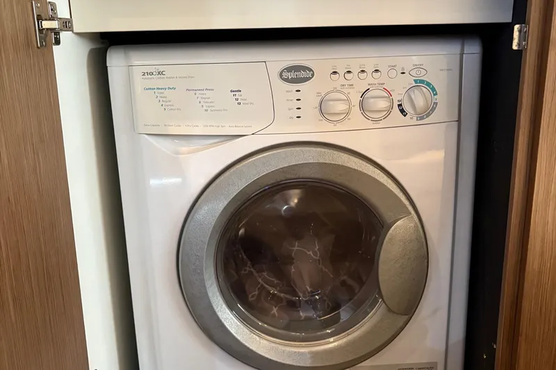 Slide: The Image of Splendide 2100XC washer-dryer in 2015 Meridian 441 Sedan yacht interior. - 14