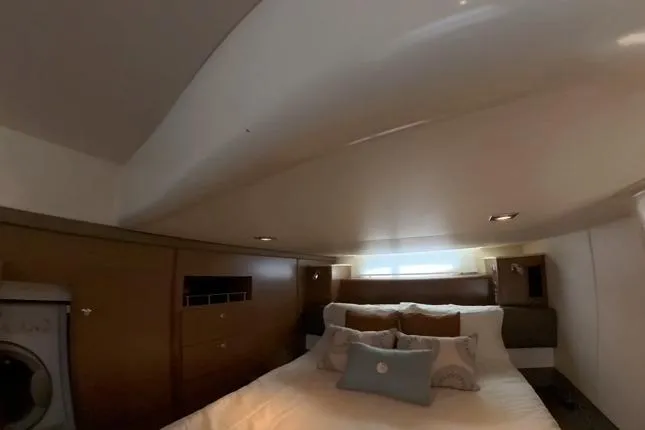 Slide: The Image of Luxurious bedroom interior of 2015 Meridian 441 Sedan yacht with cozy bedding. - 15