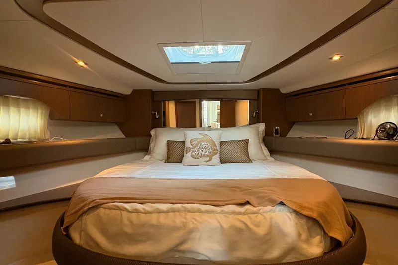 Slide: The Image of Luxurious bedroom interior of 2015 Meridian 441 Sedan yacht with elegant bedding and ambient lighting. - 17