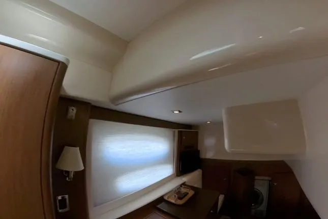 Slide: The Image of Interior of 2015 Meridian 441 Sedan yacht, featuring elegant wood paneling and modern lighting. - 20