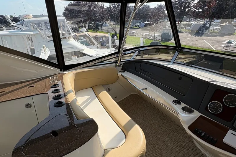 Slide: The Image of Interior of 2015 Meridian 441 Sedan yacht with luxurious seating and dashboard view. - 4
