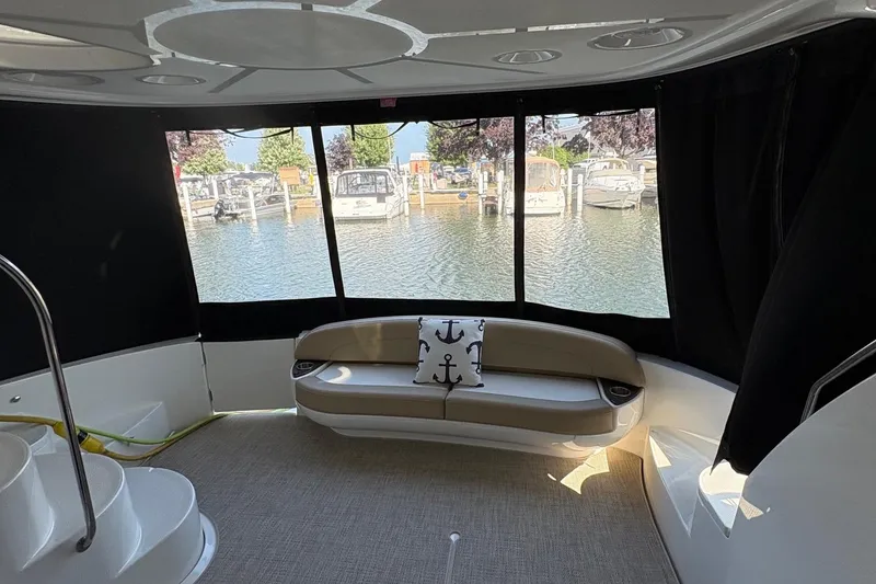 Slide: The Image of Interior view of 2015 Meridian 441 Sedan yacht with waterfront backdrop. - 7