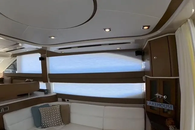 Slide: The Image of Interior of 2015 Meridian 441 Sedan yacht with modern design and comfortable seating. - 9