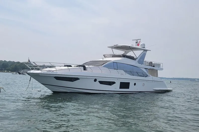 The Image of 2022 Azimut 66 yacht on calm water, showcasing sleek design and modern features. - 1