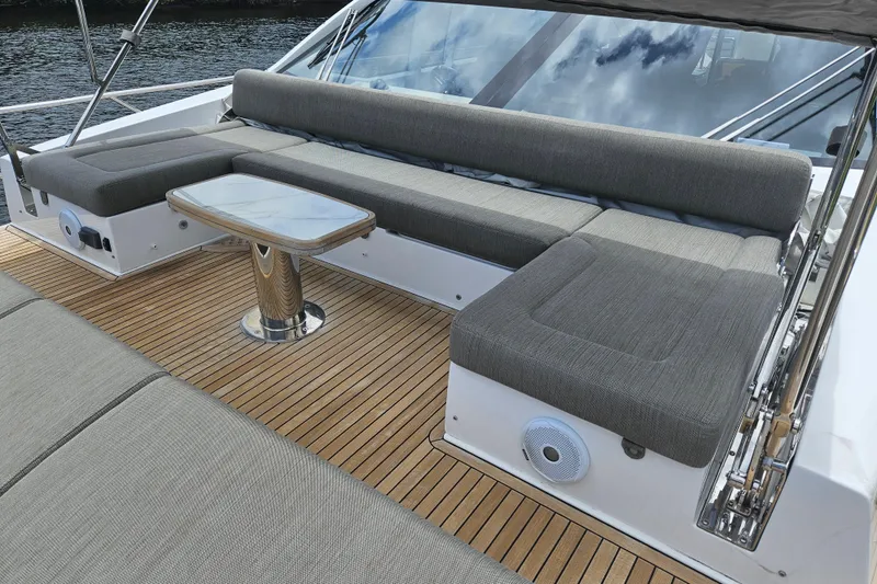 Slide: The Image of Luxurious seating area on 2022 Azimut 66 yacht with teak flooring and modern design. - 14