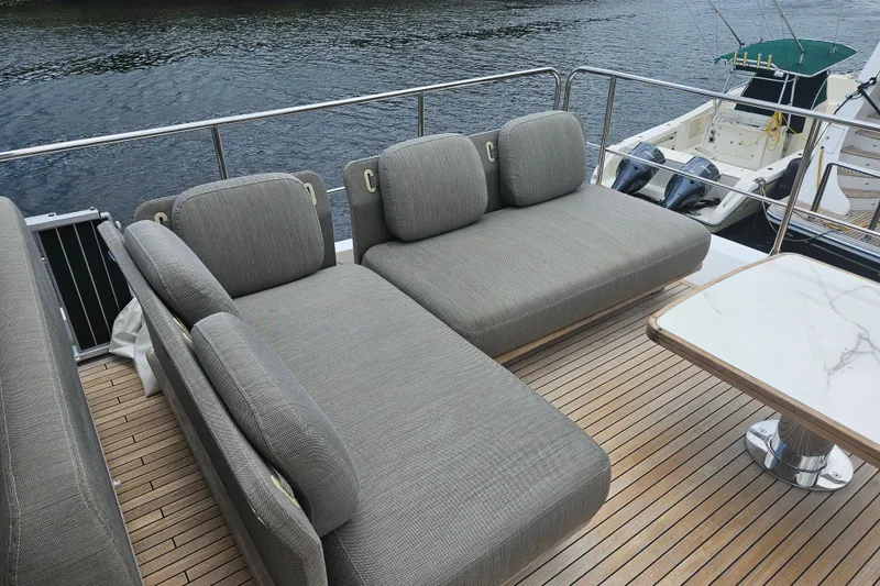 Slide: The Image of Luxurious seating area on 2022 Azimut 66 yacht with elegant wooden deck. - 15