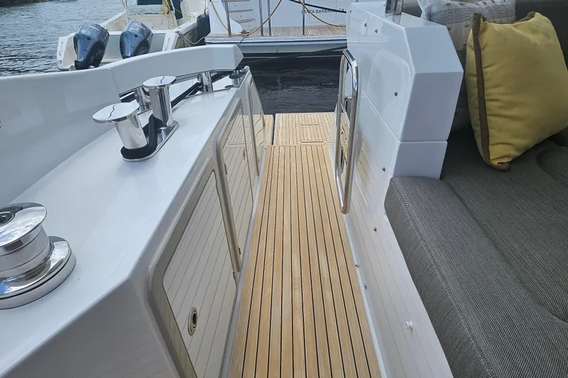 Slide: The Image of Luxurious Azimut 66 yacht deck with teak flooring and comfortable seating, 2022 model. - 21