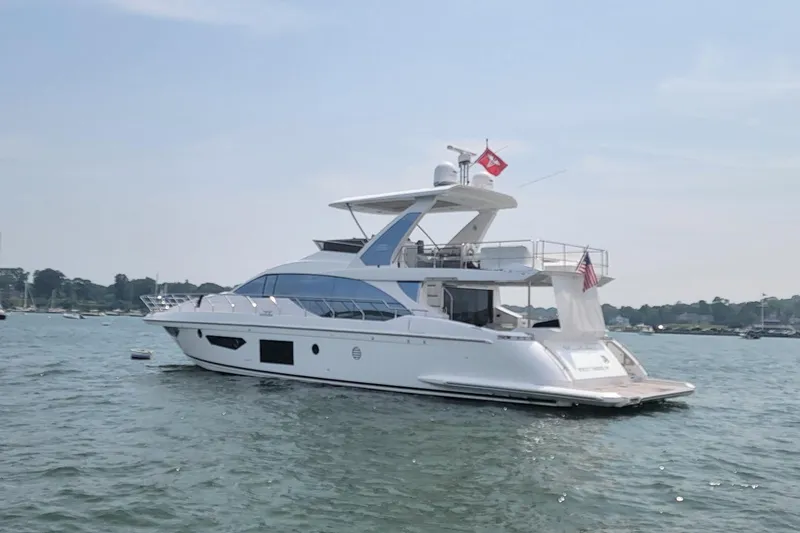 Slide: The Image of 2022 Azimut 66 yacht on calm water, featuring sleek design and modern amenities. - 3