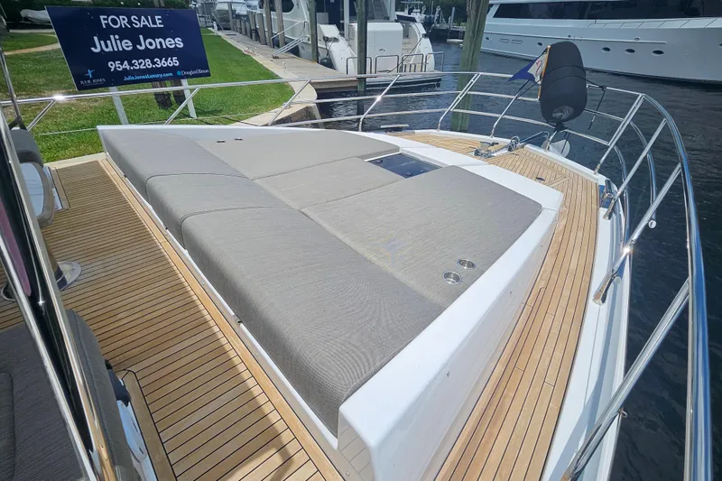 Slide: The Image of 2022 Azimut 66 yacht for sale, featuring spacious deck and luxurious sunbathing area. - 31