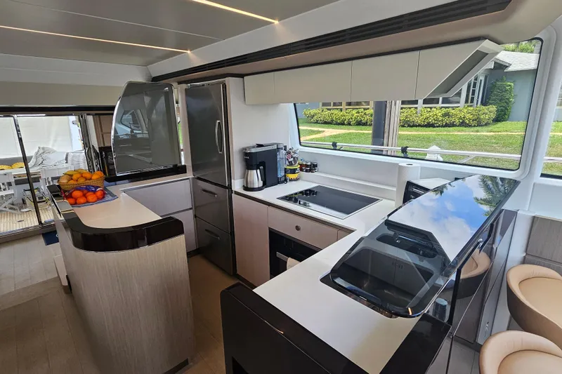 Slide: The Image of Luxurious 2022 Azimut 66 yacht kitchen with modern appliances and sleek design. - 42