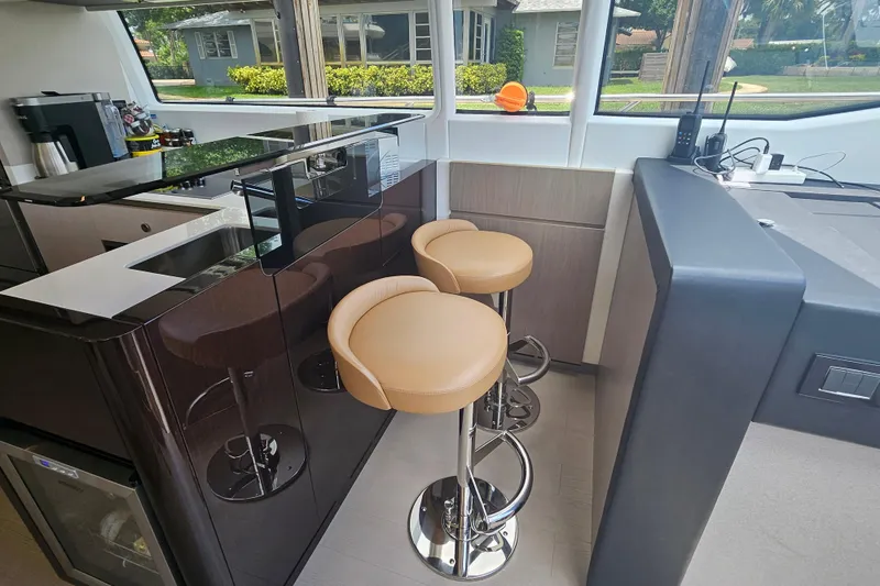 Slide: The Image of Luxurious interior of 2022 Azimut 66 yacht with modern bar stools and sleek design. - 43