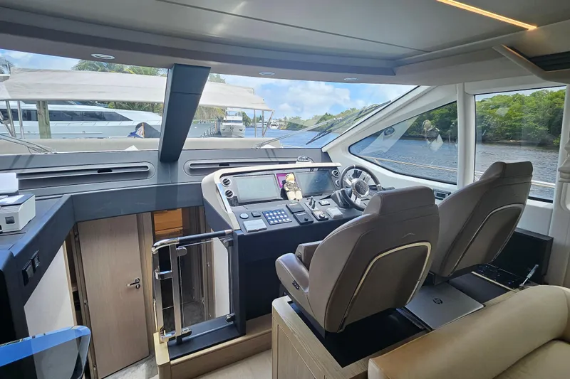 Slide: The Image of Luxurious 2022 Azimut 66 yacht cockpit with modern controls and panoramic windows. - 44