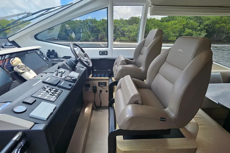 Slide: The Image of Luxurious helm of 2022 Azimut 66 yacht with leather seats and advanced controls. - 45