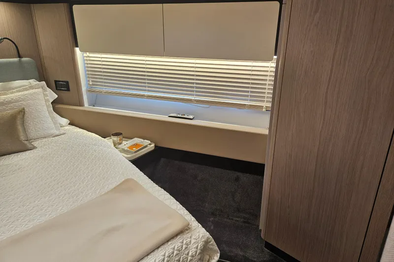 Slide: The Image of Luxurious bedroom interior of 2022 Azimut 66 yacht with elegant bedding and modern design. - 50