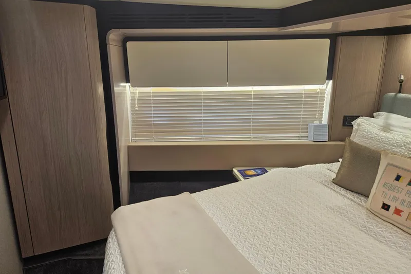 Slide: The Image of Luxurious bedroom interior of 2022 Azimut 66 yacht with elegant bedding and modern design. - 51