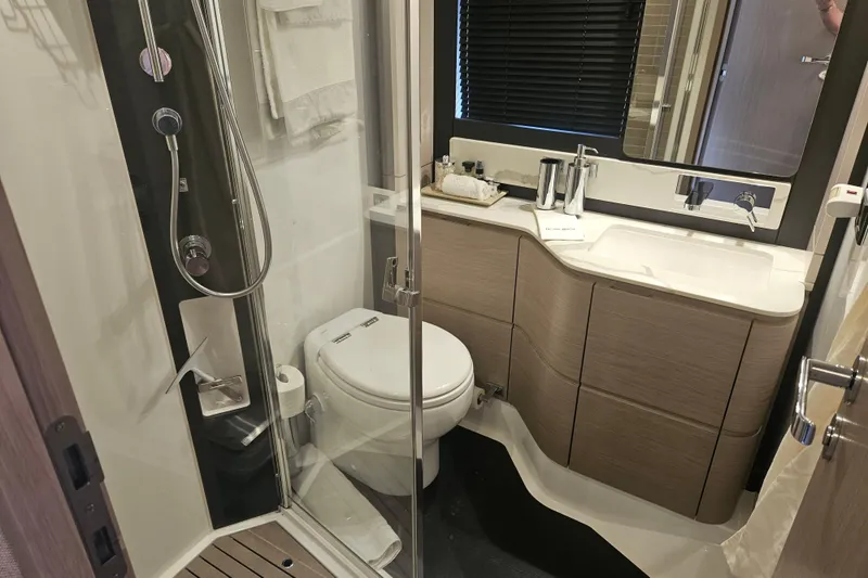 Slide: The Image of Luxurious bathroom in 2022 Azimut 66 yacht, featuring modern fixtures and elegant design. - 52
