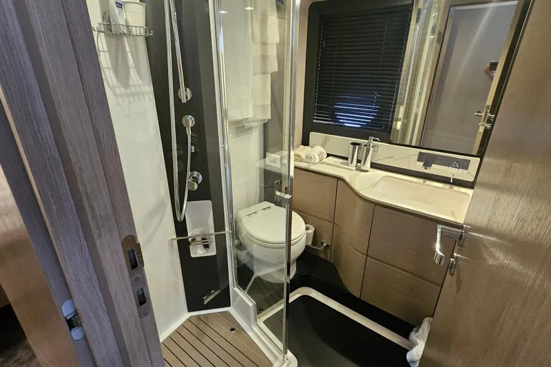 Slide: The Image of Luxurious bathroom in 2022 Azimut 66 yacht with modern fixtures and elegant design. - 55
