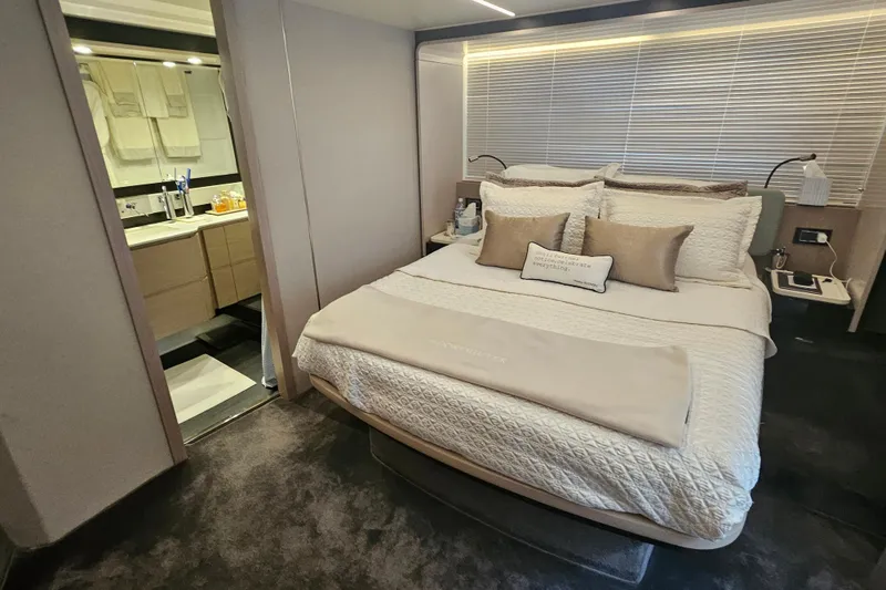 Slide: The Image of Luxurious bedroom and bathroom in 2022 Azimut 66 yacht, featuring elegant decor and modern amenities. - 62
