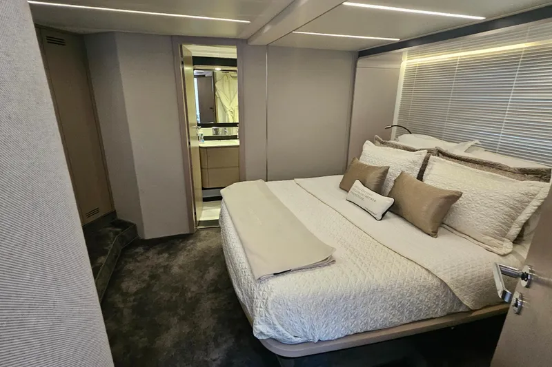 Slide: The Image of Luxurious bedroom interior of 2022 Azimut 66 yacht with elegant bedding and modern design. - 67