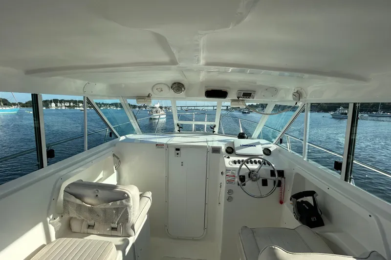Slide: The Image of Interior view of 2011 Baha Cruisers 277 GLE boat cockpit with steering wheel and controls. - 12