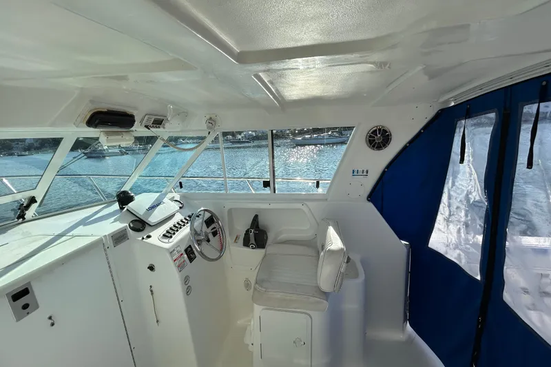 Slide: The Image of Interior view of 2011 Baha Cruisers 277 GLE boat with helm and seating. - 15