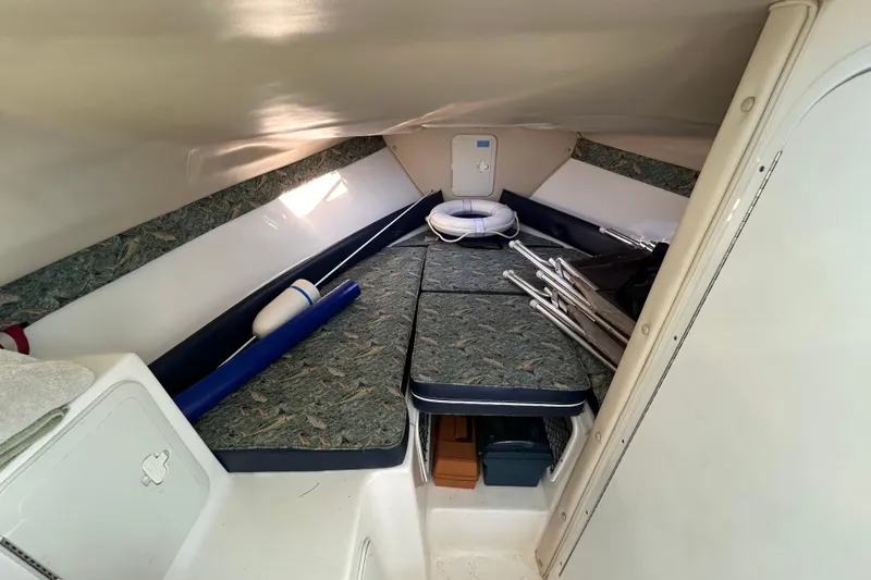 Slide: The Image of 2011 Baha Cruisers 277 GLE cabin interior with seating and storage. - 20