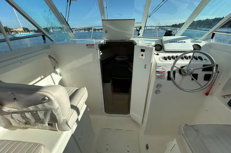 Slide: The Image of Interior view of 2011 Baha Cruisers 277 GLE boat cockpit with steering wheel and seating. - 22