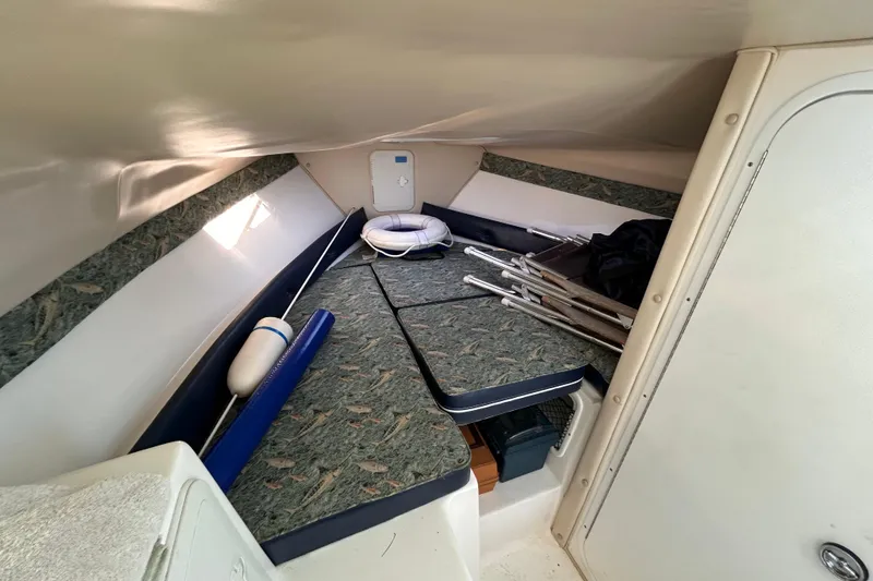 Slide: The Image of 2011 Baha Cruisers 277 GLE cabin interior with seating and storage. - 23