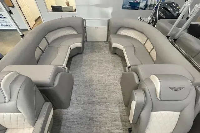 Slide: The Image of 2025 Bennington L22 pontoon boat interior with luxurious gray seating and modern design. - 4