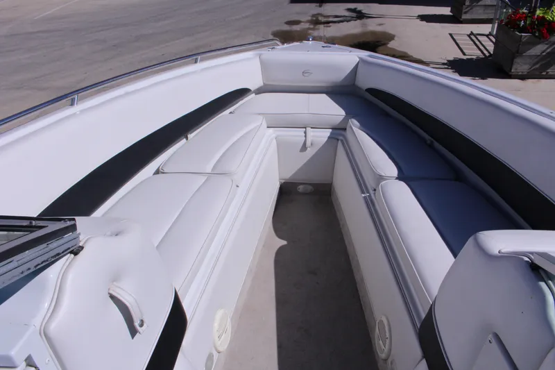 Slide: The Image of 2005 Crownline 266 BR boat interior with white seating and black accents. - 6