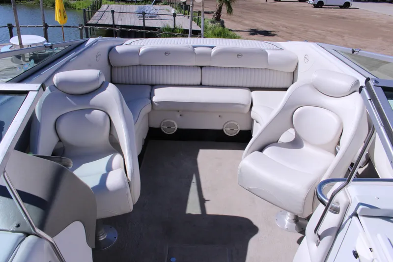 Slide: The Image of 2005 Crownline 266 BR boat interior with white leather seating and spacious layout. - 7