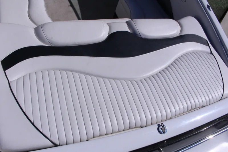 Slide: The Image of 2005 Crownline 266 BR boat interior with stylish white and black seating design. - 9