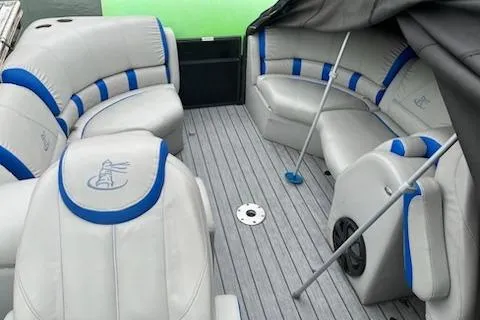Slide: The Image of 2018 Misty Harbor S2385SU pontoon boat interior with gray and blue seating. - 3